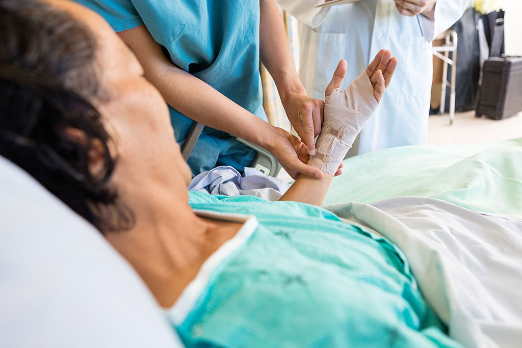 Closeup Of A Nurse Adjusting The Bandage On A Senior Woman's Hand Non-Healing Wounds In Elderly